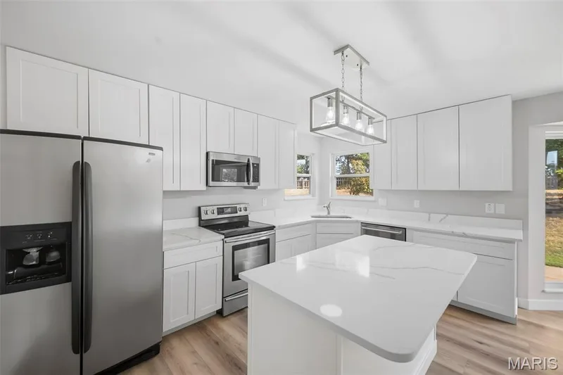Center Island with breakfast bar lip. — 1014 Wake Court, Wentzville, MO 63385