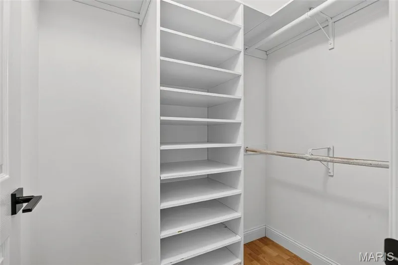 Walk-in closet in primary bedroom — 6401 Long Timber Drive, O'Fallon, MO 63368