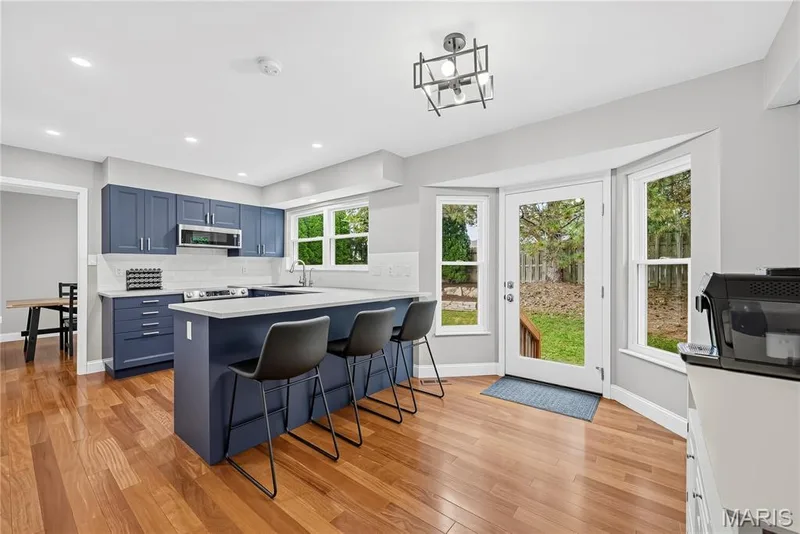 Breakfast Bar and Bay Window with Atrium Door opening to Patio — 1645 Wild Goose Run, St Charles, MO 63303