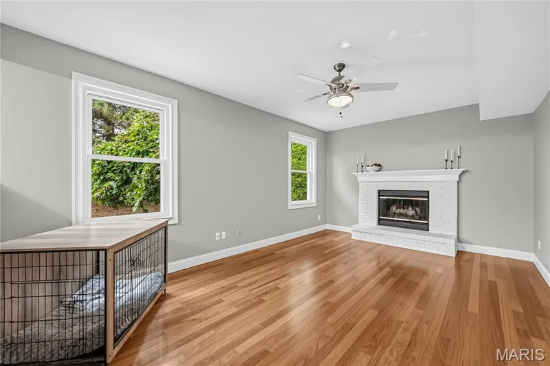Family Room with Gas Fireplace and Engineered Hardwood Flooring — 1645 Wild Goose Run, St Charles, MO 63303
