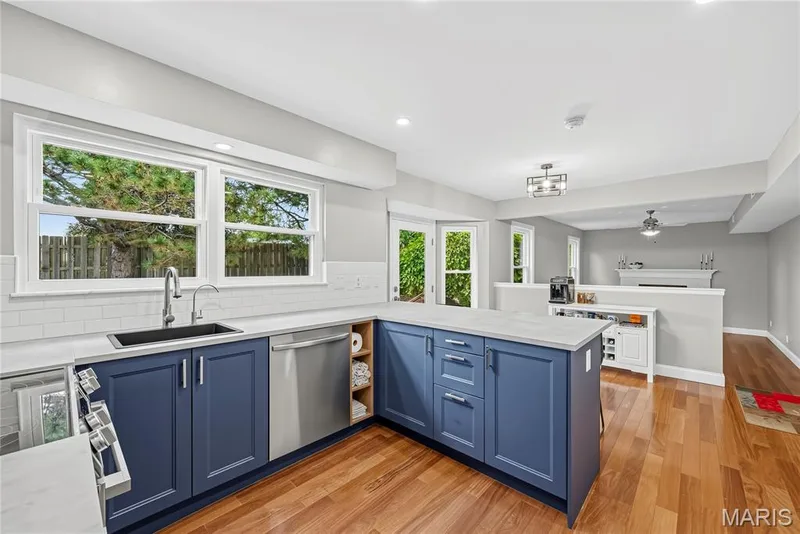 Kitchen open to Breakfast Area and Family Room — 1645 Wild Goose Run, St Charles, MO 63303