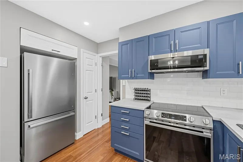 Kitchen with Updated Cabinetry, Stainless Steel Appliances and Pantry — 1645 Wild Goose Run, St Charles, MO 63303