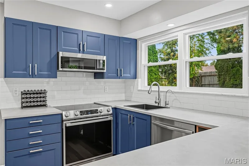 Smooth Top Electric Range and Above the Range Microwave — 1645 Wild Goose Run, St Charles, MO 63303