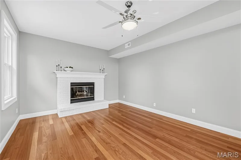 Gas Fireplace in Family Room with Painted Brick Surround — 1645 Wild Goose Run, St Charles, MO 63303