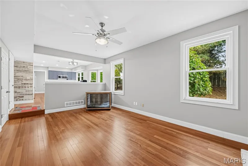 Step Down Family Room with Engineered Wood Flooring — 1645 Wild Goose Run, St Charles, MO 63303
