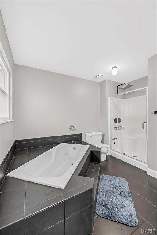 Primary Bath with Soaking Tub and Shower — 1645 Wild Goose Run, St Charles, MO 63303