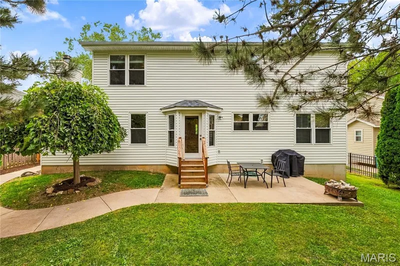 Rear Elevation with Patio and Sidewalk to Front of Home — 1645 Wild Goose Run, St Charles, MO 63303