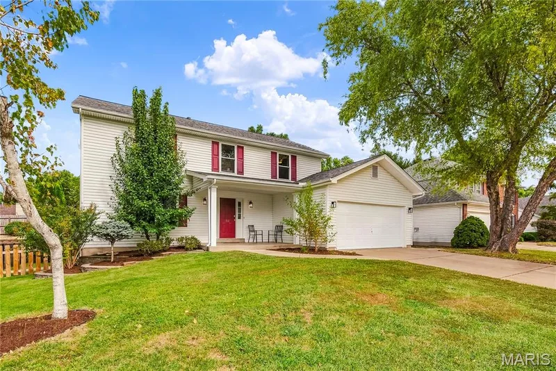 Front Elevation with Landscaping and Covered Front Porch — 1645 Wild Goose Run, St Charles, MO 63303