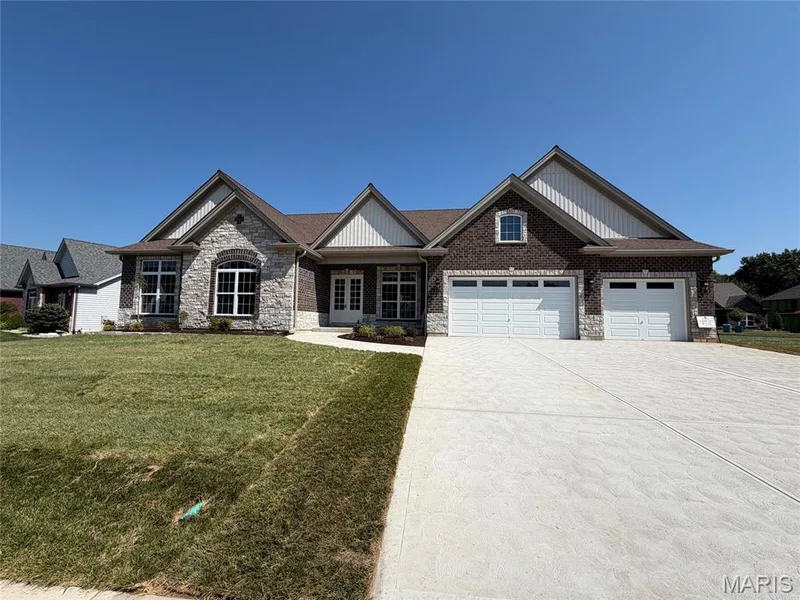 Stone and brick exterior with gabled roof lines — 1000 Bellevaux Place, St Charles, MO 63301