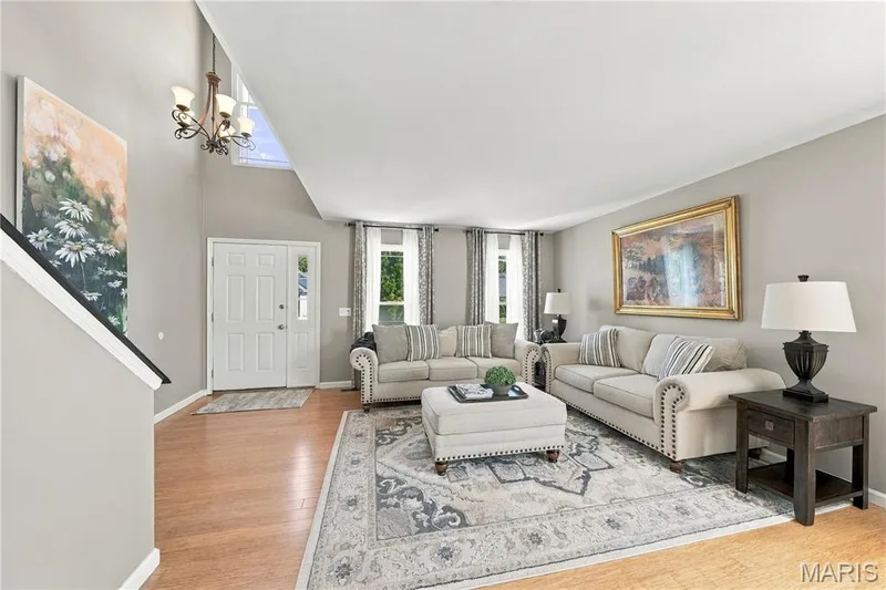 Updated double hung windows, wood floors and neutral decor. — 1417 Plantation Manor Court, St Peters, MO 63303