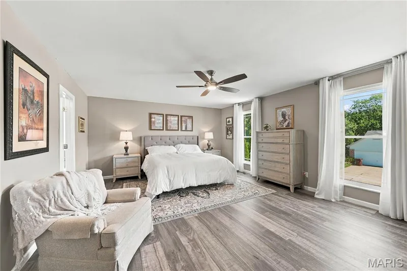 Updated double hung windows, luxury vinyl plank flooring, lighted ceiling fan and neutral decor. — 1417 Plantation Manor Court, St Peters, MO 63303