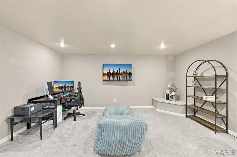 Carpeted flooring, sump pit in corner, recessed lighting and neutral decor. — 1417 Plantation Manor Court, St Peters, MO 63303