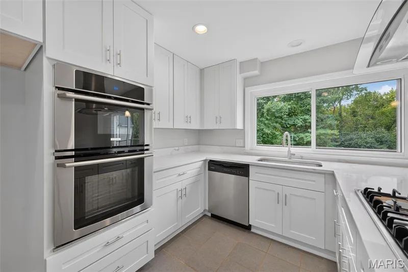 Stainless steel double wall oven, stainless steel dishwasher, under mount sink, and recessed lighting — 231 Renaldo Drive, Chesterfield, MO 63017