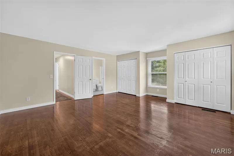 Spacious master bedroom featuring beautiful hardwood flooring. — 231 Renaldo Drive, Chesterfield, MO 63017