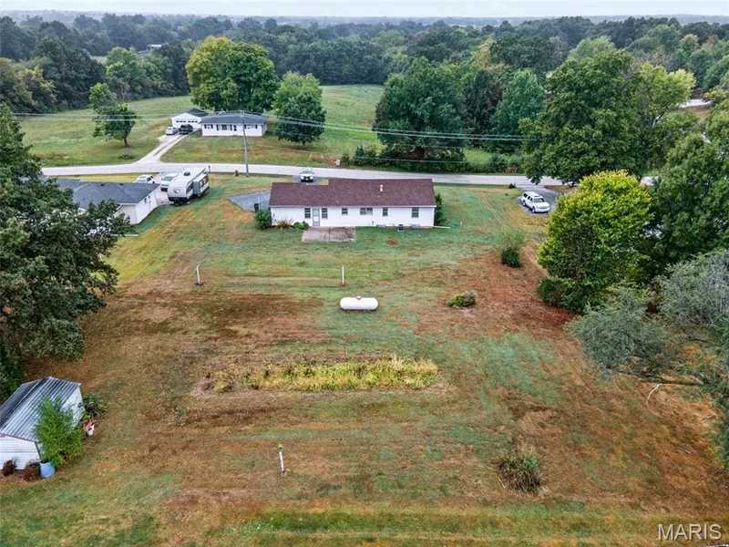So much room to make it your own! This expansive backyard offers endless possibilities for outdoor living, gardening, play and entertaining. — 219 Mexico Road, Wentzville, MO 63385