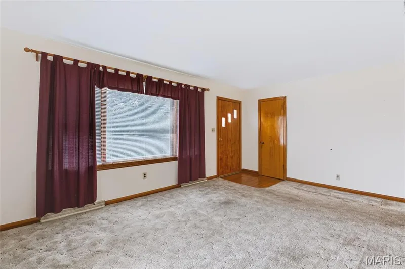 Living Room - See Virtually Staged Photo for Inspiration - Hardwood Floors under the Carpeting. — 219 Mexico Road, Wentzville, MO 63385