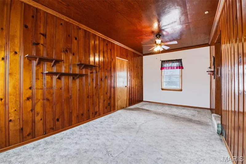 Virtually Staged Family Room off of the Kitchen and Garage - Would also make a nice Home Office or anything your heart desires - Living Room and Family Room on the Main Level of the Home! — 219 Mexico Road, Wentzville, MO 63385