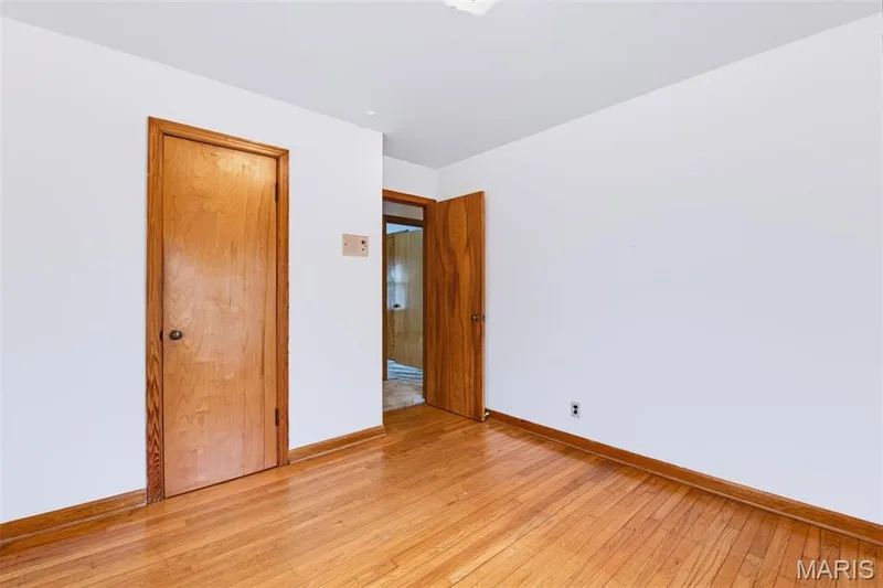 Bedroom with Hardwood Flooring - it's under the carpet in the living room, hallway and the other two bedrooms as well. — 219 Mexico Road, Wentzville, MO 63385