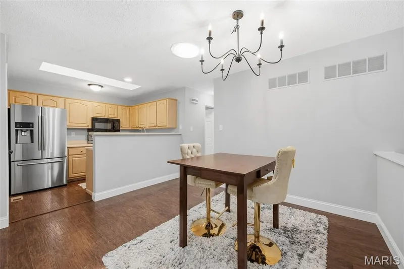 Dining Area and Kitchen with Laminate Flooring — 3248 Meadow Trail Drive #75, St Peters, MO 63376