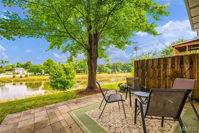 Patio with View of Common Ground and Pond in an adjoining Neighborhood — 3248 Meadow Trail Drive #75, St Peters, MO 63376