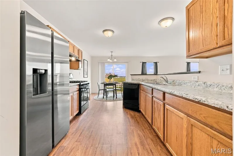 Kitchen with custom cabinetry and appliances — 104 Baycrest Court, St Charles, MO 63301