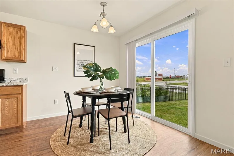 Sliding doors off of dining area lead to backyard — 104 Baycrest Court, St Charles, MO 63301