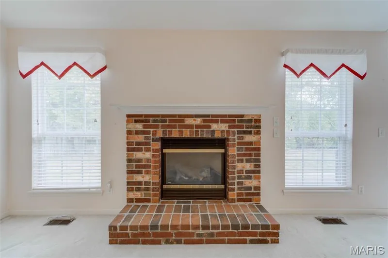 Gas Fireplace With Brick Surround & Raised Hearth — 2107 McGregor Circle, O'Fallon, MO 63368