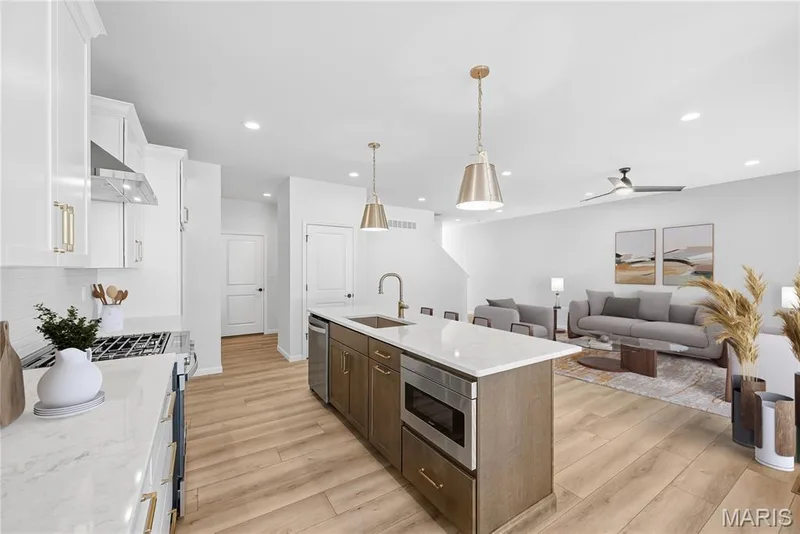 Kitchen and Family Room shown with Virtual Staging — 53 Pheasant Ring Drive, St Peters, MO 63376