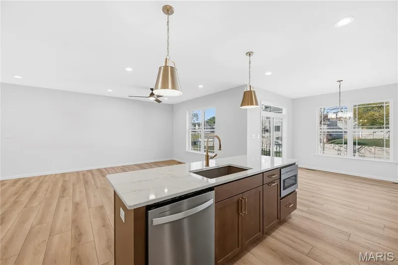 Kitchen open to Family Room and Dining Room — 53 Pheasant Ring Drive, St Peters, MO 63376