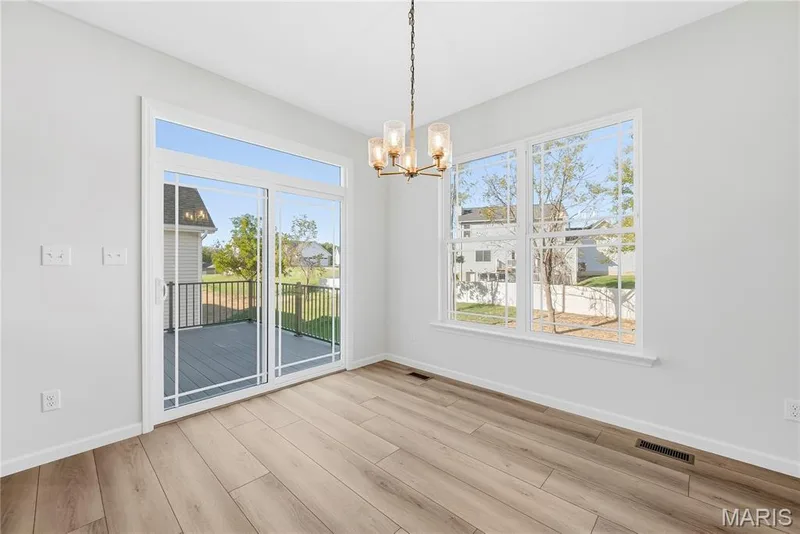 Sliding Glass Door with Transom Window in Dining Room — 53 Pheasant Ring Drive, St Peters, MO 63376