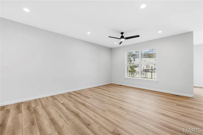 Family Room with 9 Foot Ceilings, Recessed Lighting and Luxury Vinyl Plank Flooring — 53 Pheasant Ring Drive, St Peters, MO 63376