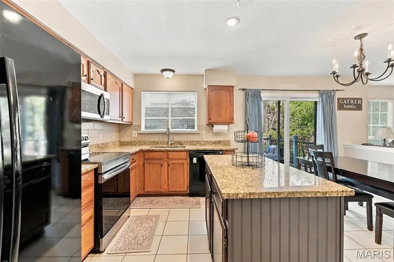 Open and bright kitchen with spacious eating area — 5872 Wellington Farm Drive, St Charles, MO 63304