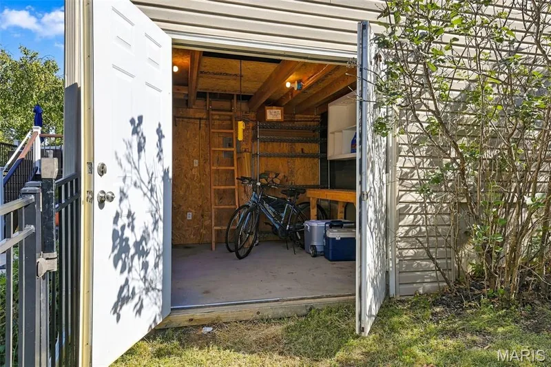 Work shop, storage or golf cart / toys parking, even has a loft for storage or kid hang out, piped for air hose and hoist — 5872 Wellington Farm Drive, St Charles, MO 63304