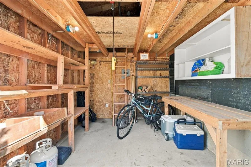 storage for extra toys or workshop with hoist, loft, shelving and a line for air tank — 5872 Wellington Farm Drive, St Charles, MO 63304