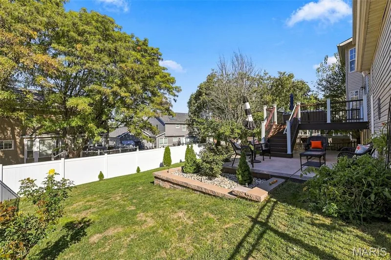 Fenced yard with spacious deck, two patios and freshly landscaped — 5872 Wellington Farm Drive, St Charles, MO 63304