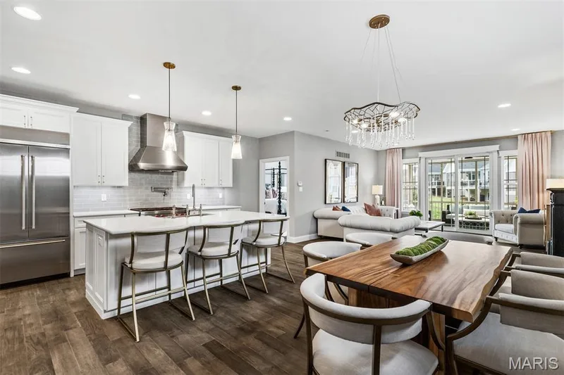 Open concept living space featuring wood-finish flooring — 17028 Fire Glow Drive, Ballwin, MO 63011