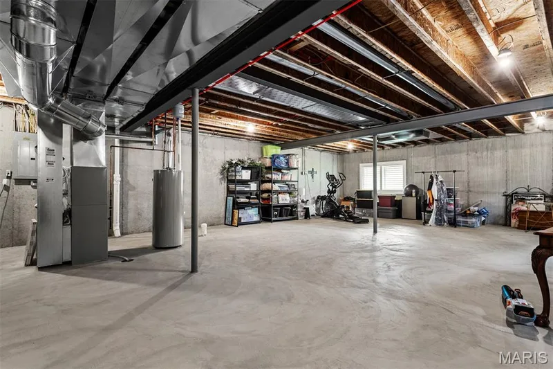 Unfinished concrete floor, exposed joist ceiling, concrete foundation walls, and multiple mechanical systems — 17028 Fire Glow Drive, Ballwin, MO 63011