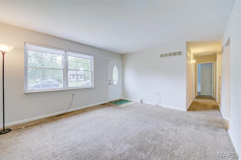 Another view of the living room leading down the hall to the bedrooms and bathroom. — 3215 Janton Lane, St Charles, MO 63301