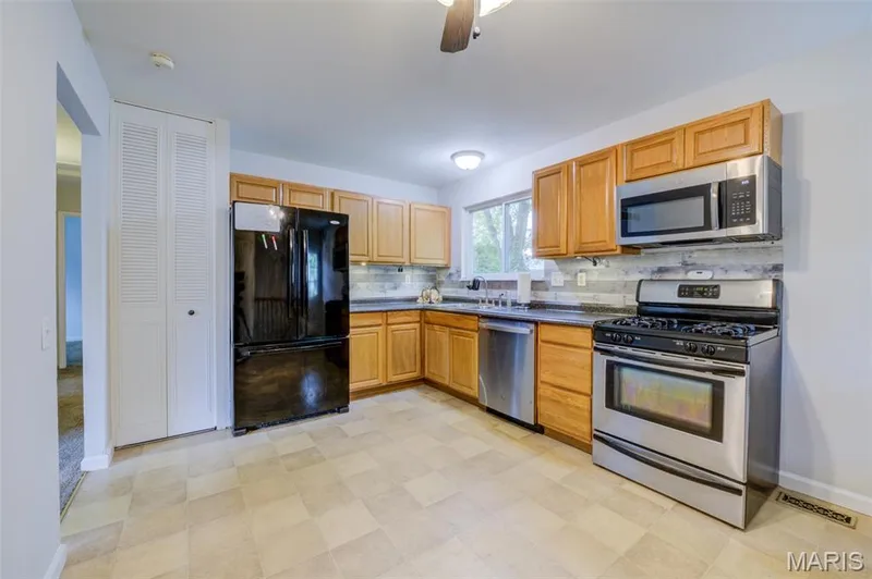 There is also a convenient pantry to the left of the refrigerator. — 3215 Janton Lane, St Charles, MO 63301