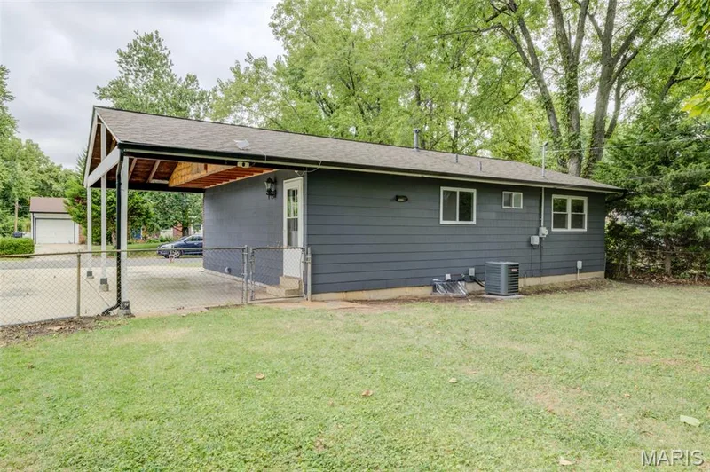 Freshly painted back side of the property.  Notice the storage above the carport! — 3215 Janton Lane, St Charles, MO 63301