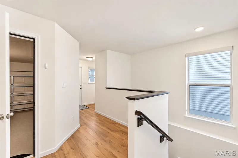 Wood-finish flooring, recessed lighting, and a window with blinds — 284 Crestfield Court, St Charles, MO 63301