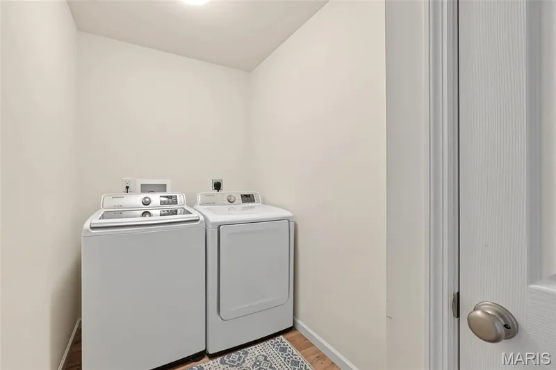 Dedicated utility space featuring neutral wall tones — 284 Crestfield Court, St Charles, MO 63301