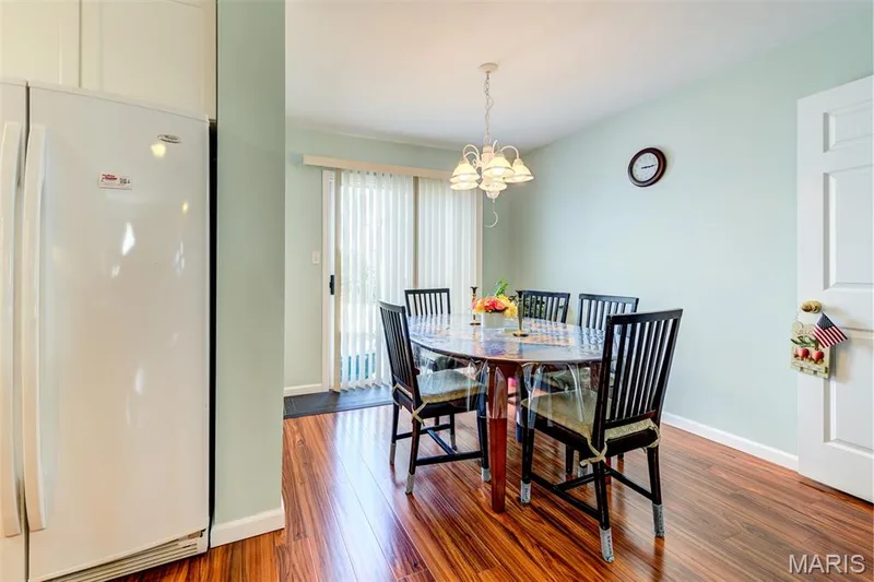 Wood-finish flooring with a white paneled door and light-colored walls — 820 Brookmead Drive, O'Fallon, MO 63366