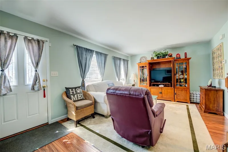 Hardwood-finish flooring complements the light-toned walls — 820 Brookmead Drive, O'Fallon, MO 63366