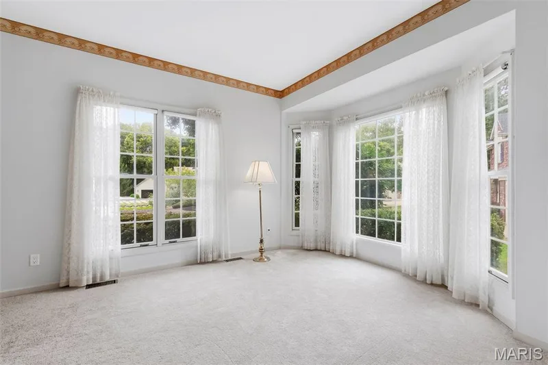 Light-colored wall-to-wall carpeting complements the white wall finishes — 11 Silver Leaf Court, Lake St. Louis, MO 63367