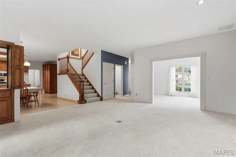 Expansive carpeted living area with recessed lighting — 11 Silver Leaf Court, Lake St. Louis, MO 63367