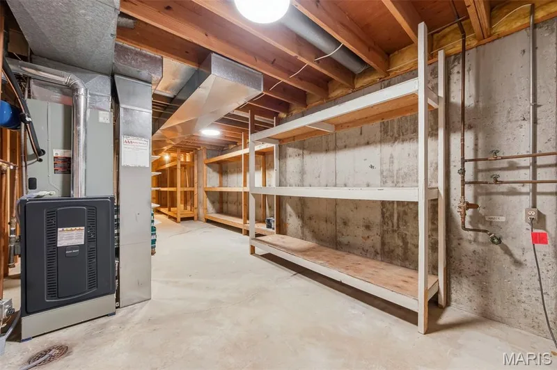 Concrete flooring and exposed ceiling beams — 11 Silver Leaf Court, Lake St. Louis, MO 63367
