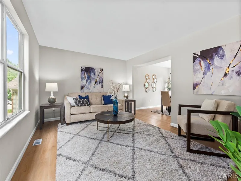 Bright living area with new vinyl plank flooring — 920 Blake Court, St Peters, MO 63376