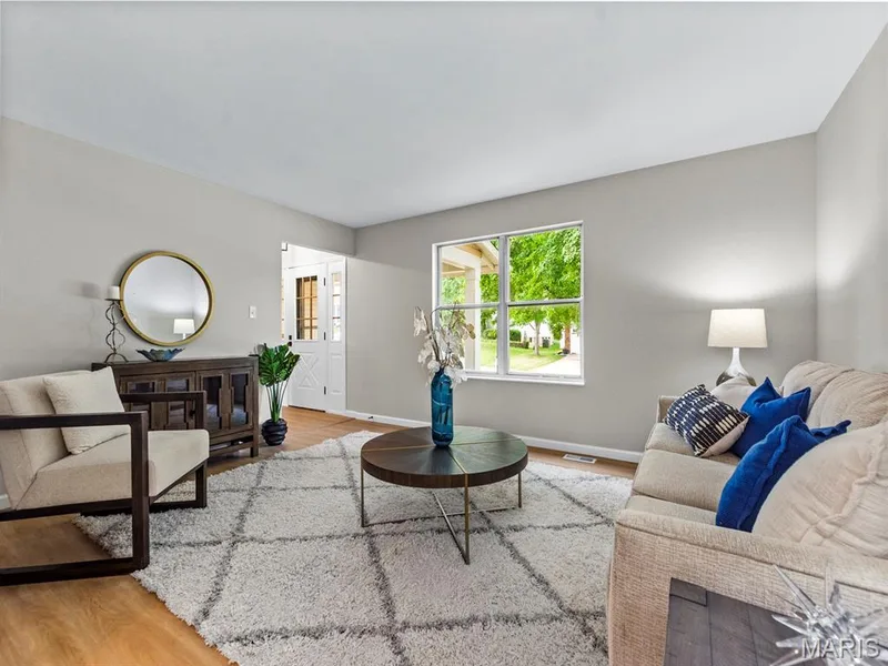 Bright living area with new vinyl plank flooring — 920 Blake Court, St Peters, MO 63376