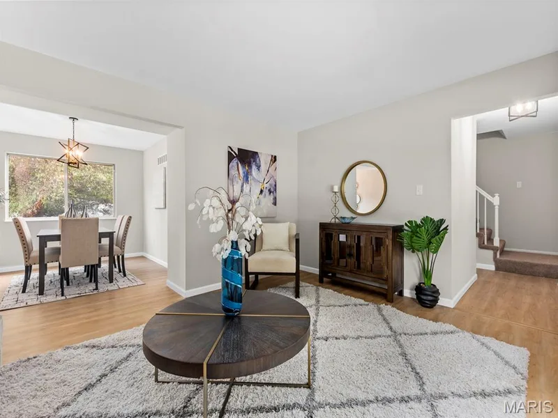 Bright living area with new vinyl plank flooring — 920 Blake Court, St Peters, MO 63376